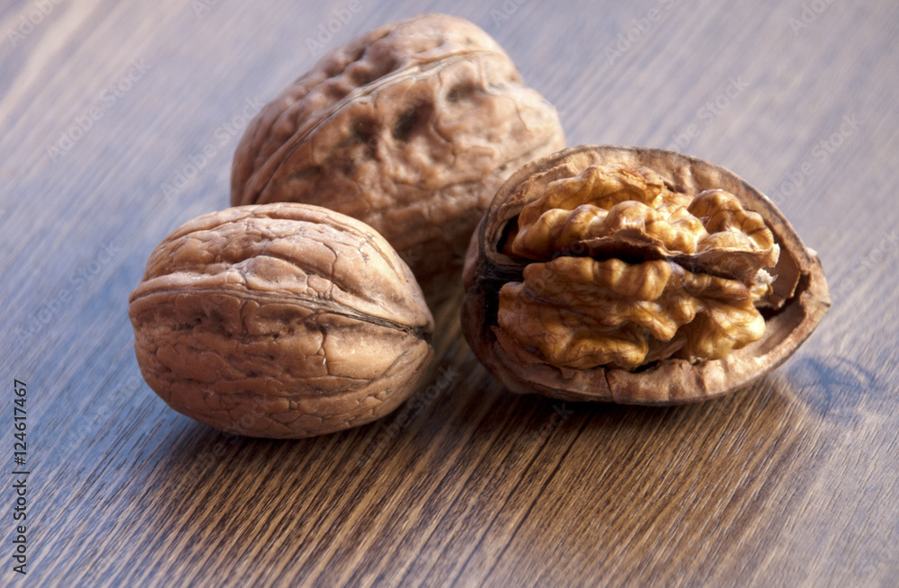 walnuts on the wooden-table. walnuts on the wooden-table.