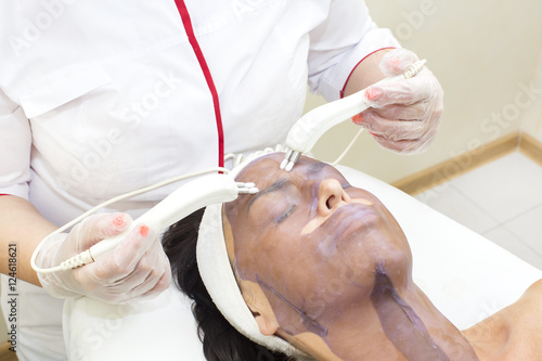 process of massage and facials in beauty salon photo