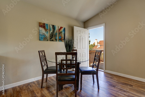 View of dining area with modern table and chair set © Iriana Shiyan