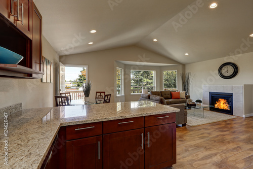 Open floor plan of kitchen  dining and living rooms