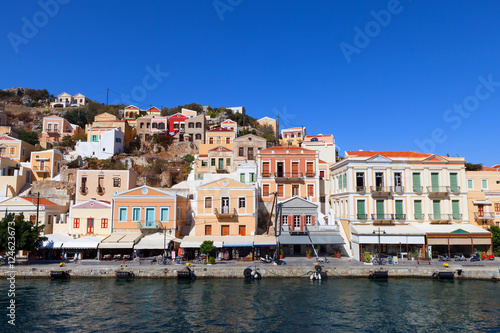 Symi island - Colorful houses and small boats at the heart of the village