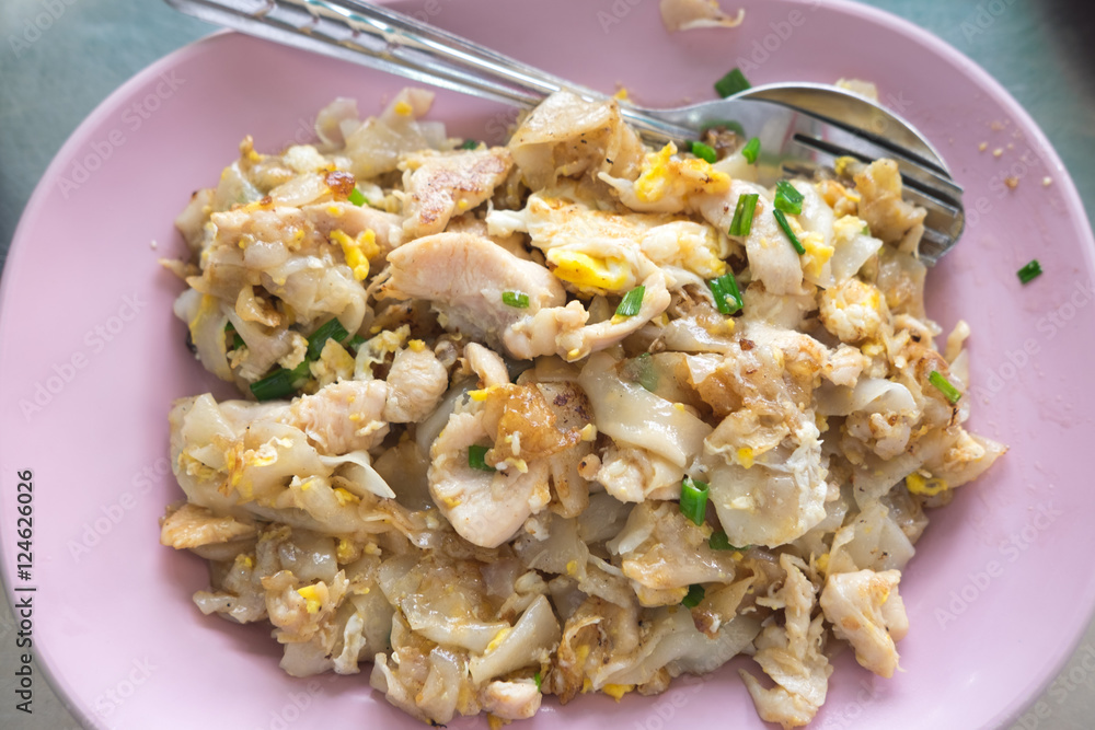Stir fried rice noodle with chicken and egg, famous Thai food