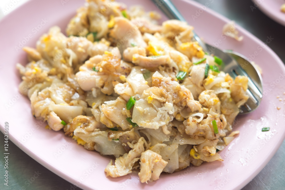 Stir fried rice noodle with chicken and egg, selective focus