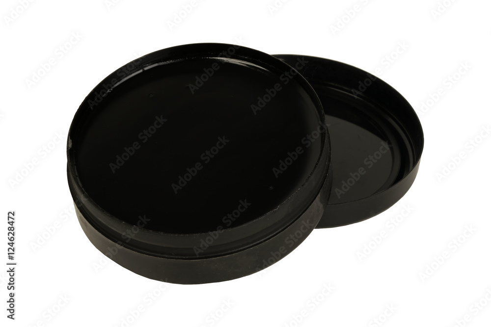 Open a bank of black shoe polish on a white background Open a bank of black shoe polish on a white background