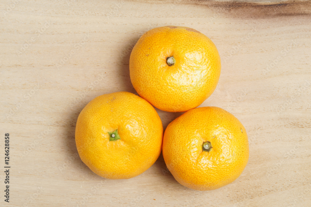Fresh oranges on the wooden table Fresh oranges on the wooden table