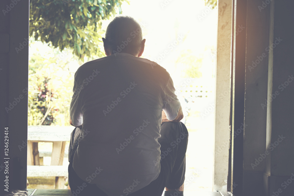 lonely old man sitting at Home