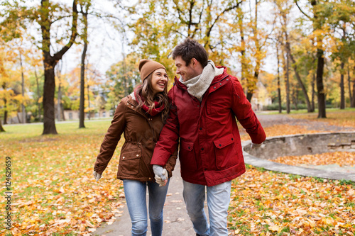 happy young couple walking in autumn park © Syda Productions