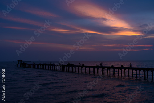  Filed wooden bridge into the sea at sunset in Thailand