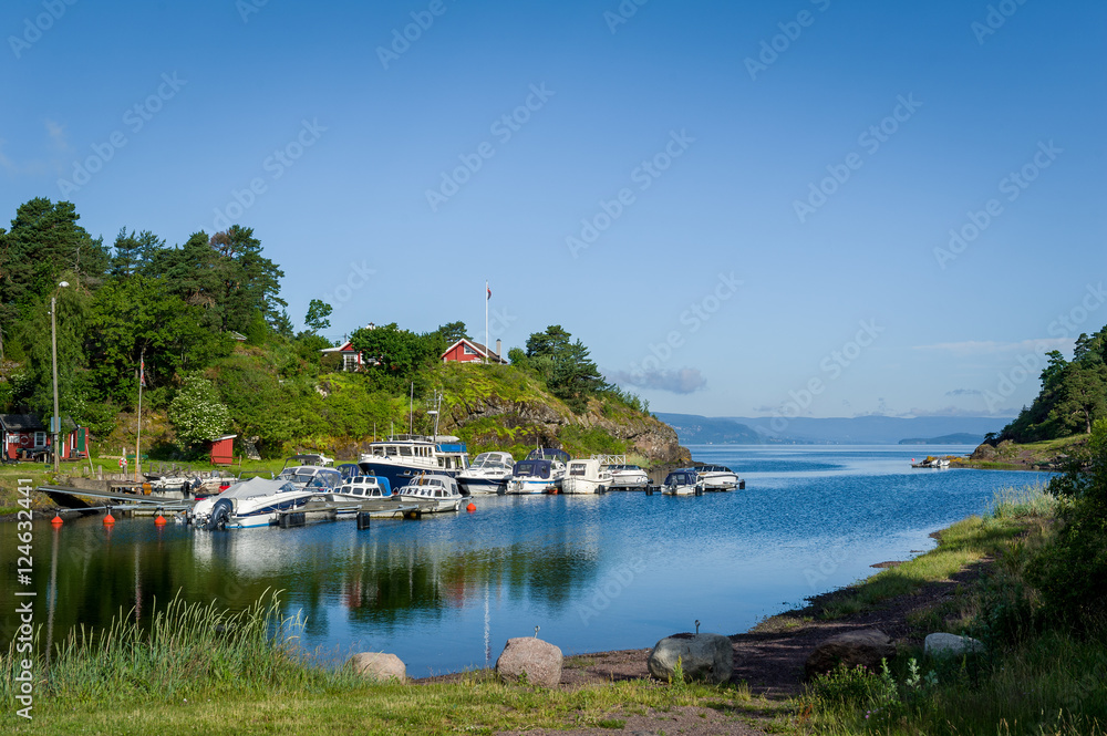 Fototapeta premium Typical nordic bay with recreational boats moored