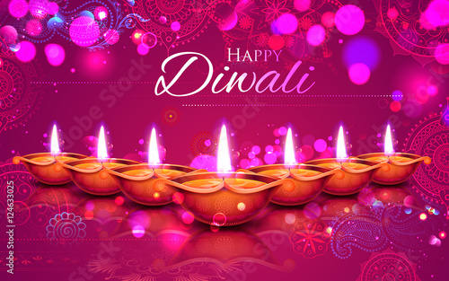 Burning diya on Happy Diwali Holiday background for light festival of India