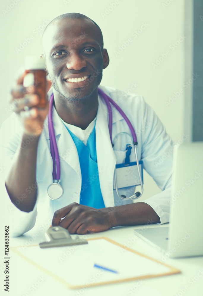 Close-up of male doctor giving jar of pills to patient. Close-up of male doctor giving jar of pills to patient.