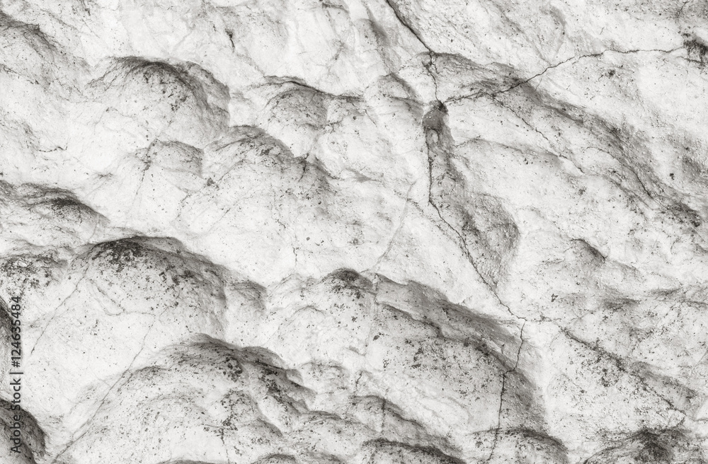 Closeup surface of stone pattern at big rock for decoration in the garden textured background in black and white tone