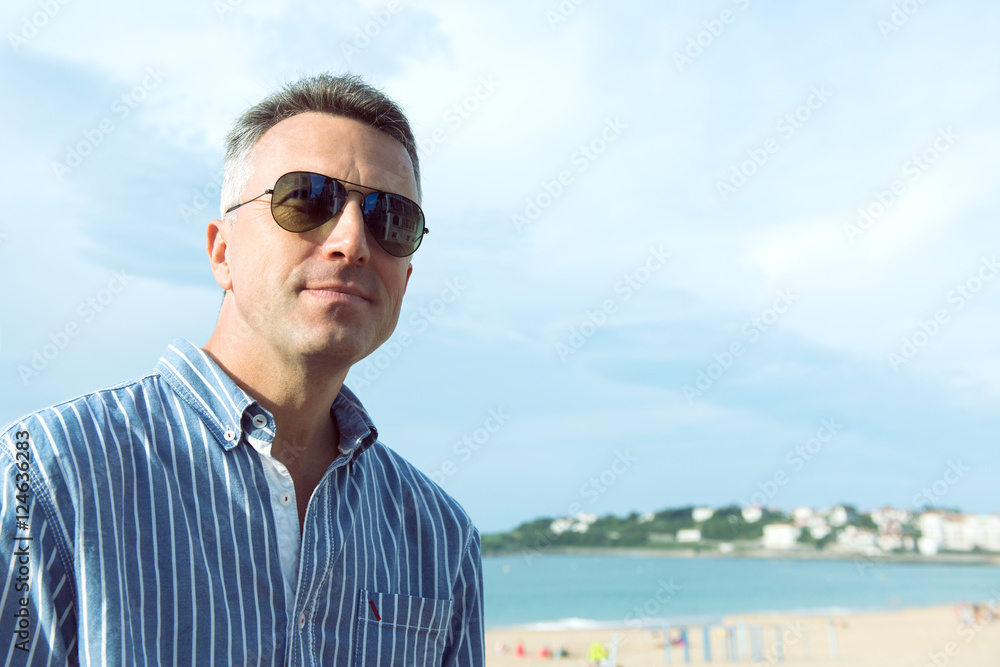 Handsome man. Outdoor male portrait. Middle-aged man resting at