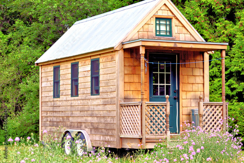 View of tiny house with porch
