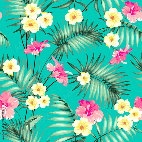 Tropical design for fabric swatch. Topical palm leaves and beautiful plumeria flowers on seamless patten over green background. Vector illustration.