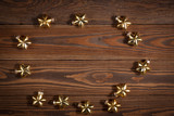 Christmas toys golden stars  on  wooden background concept Chris