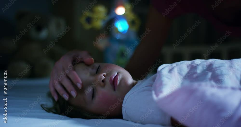 sleeping baby happy and carefree, the mother caresses kiss goodnight. concept of house and home. night and happy dreams, no mosquitoes, no noisy home and comfortable mattresses. comfortable children sleeping baby happy and carefree, the mother caresses kiss goodnight. concept of house and home. night and happy dreams, no mosquitoes, no noisy home and comfortable mattresses. comfortable children
