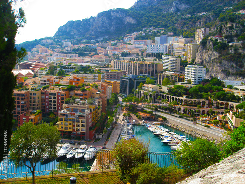 Fototapeta Naklejka Na Ścianę i Meble -  Panoramic view of Port de Fontvieille in Monaco. Azur coast. Colorful bay with a lot of luxury yachts in sunset.