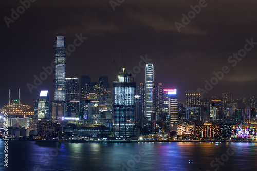 Symphony of Lights in night Hong Kong. Illuminated skyscrapers and colorful reflection in water from city lights © danr13