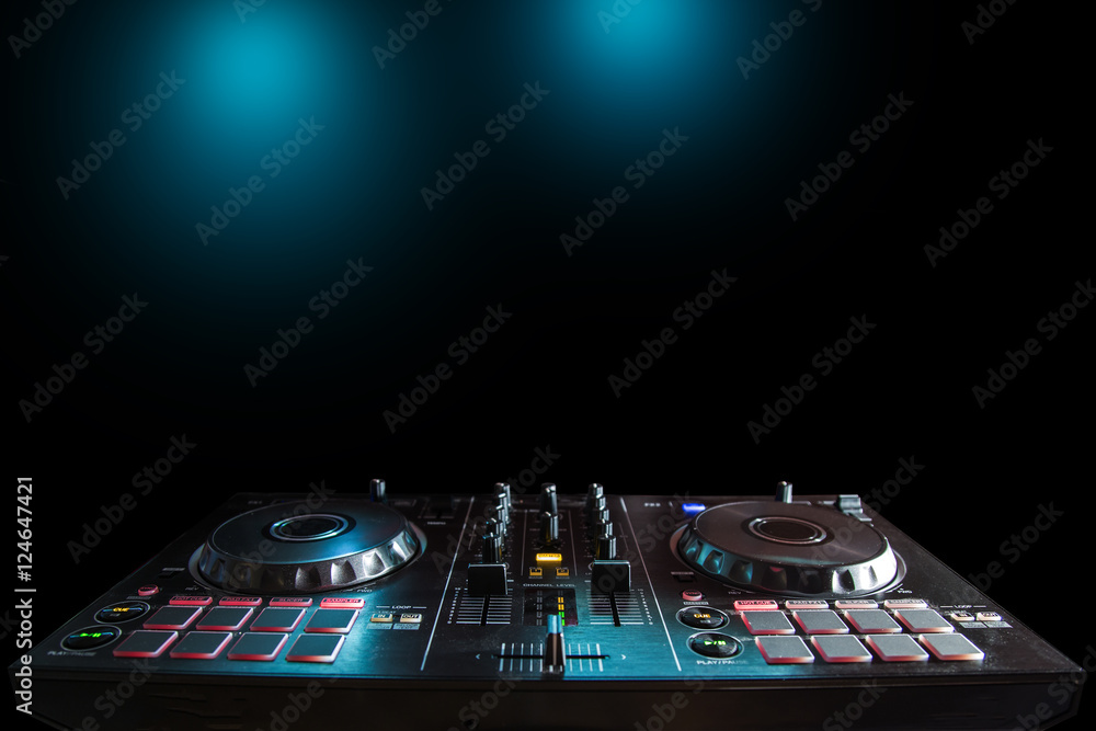 Obraz premium DJ Music night club, DJ technique - CD players and DJ console during the party. Prepared four your text.