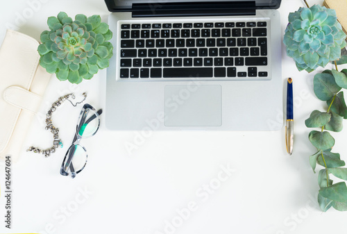 Laptop keyboard with green plants mock up flat lay styled scene  top view  copy space on white desktop