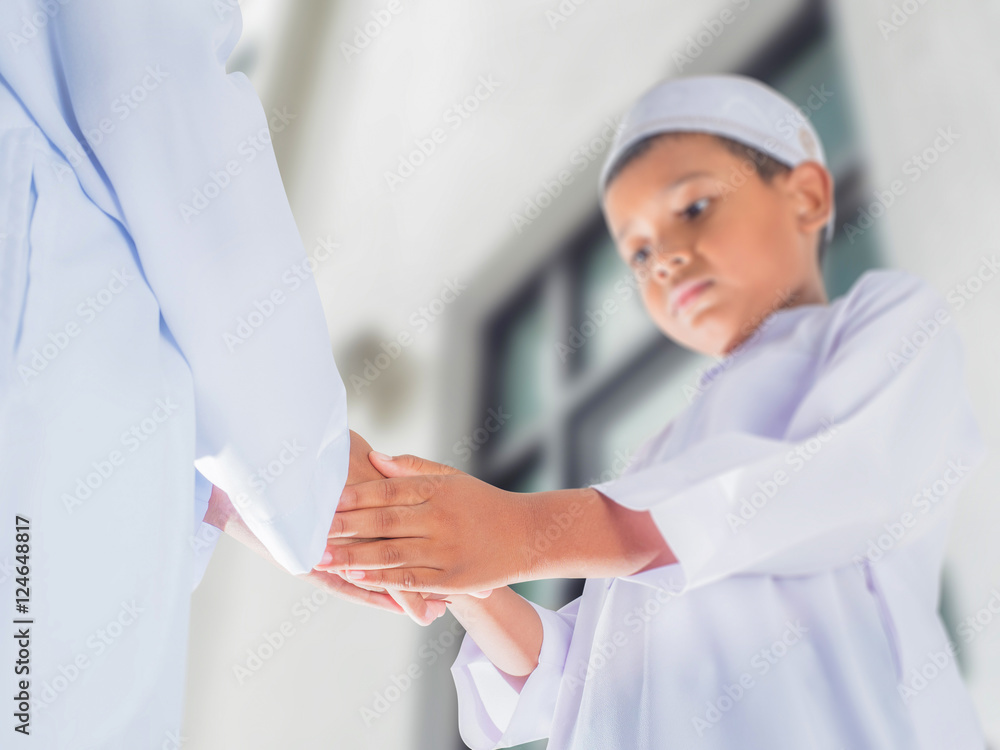 boys make greeting by Muslim style handshake in ceremony events boys make greeting by Muslim style handshake in ceremony events