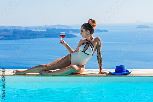 Woman in swimsuit sunbathing © Santorines