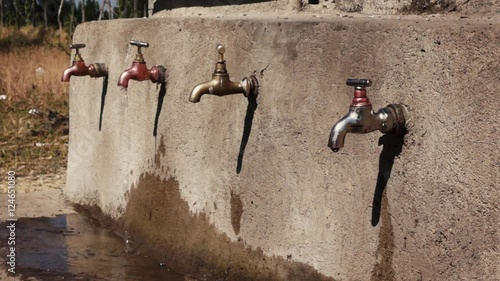 Water point with faucets at school in africa with dripping water