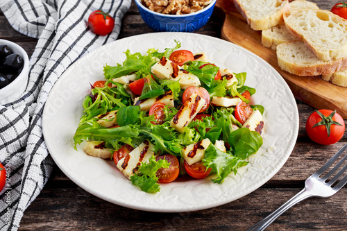 Grilled Halloumi Cheese salad witch tomatoes and lettuce. healthy food