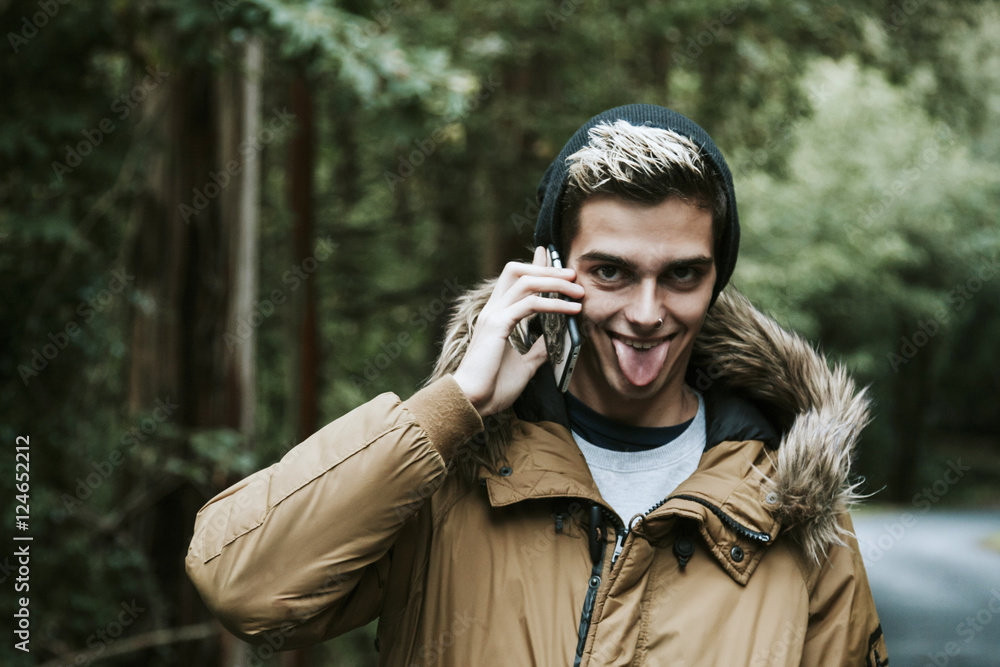 boy with mobile phone in the forest boy with mobile phone in the forest