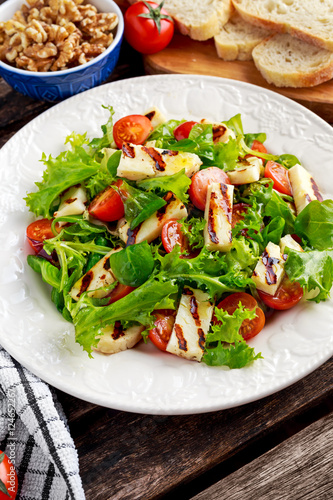 Grilled Halloumi Cheese salad witch tomatoes and lettuce. healthy food