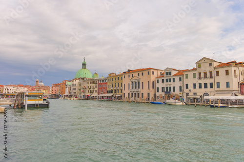 Cityscape view on the Grand canal with dome of San Piccolo Simeone church in Venice © mikhailberkut