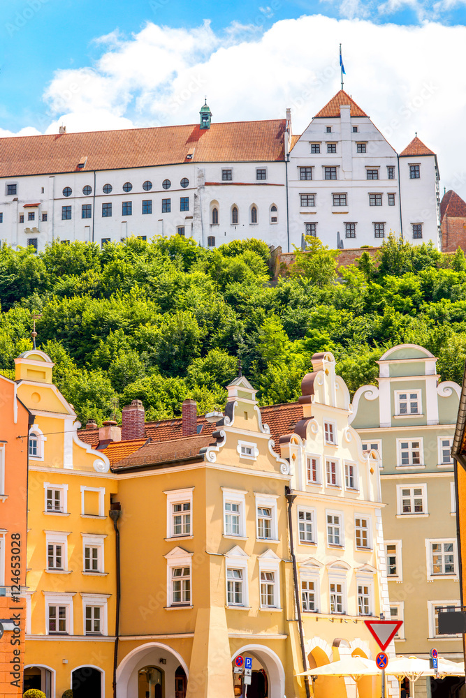 Street view with colorful bavarian houses and Trausnitz castle in Landshut old town, Germany