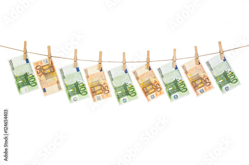 Euro banknotes hanging on clothesline on white background.