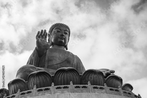 Fotografie Tian Tan Buddha (Big Buddha) statue in black&white at Ngong Ping on Lantau Island in Hong Kong, China, viewed from below