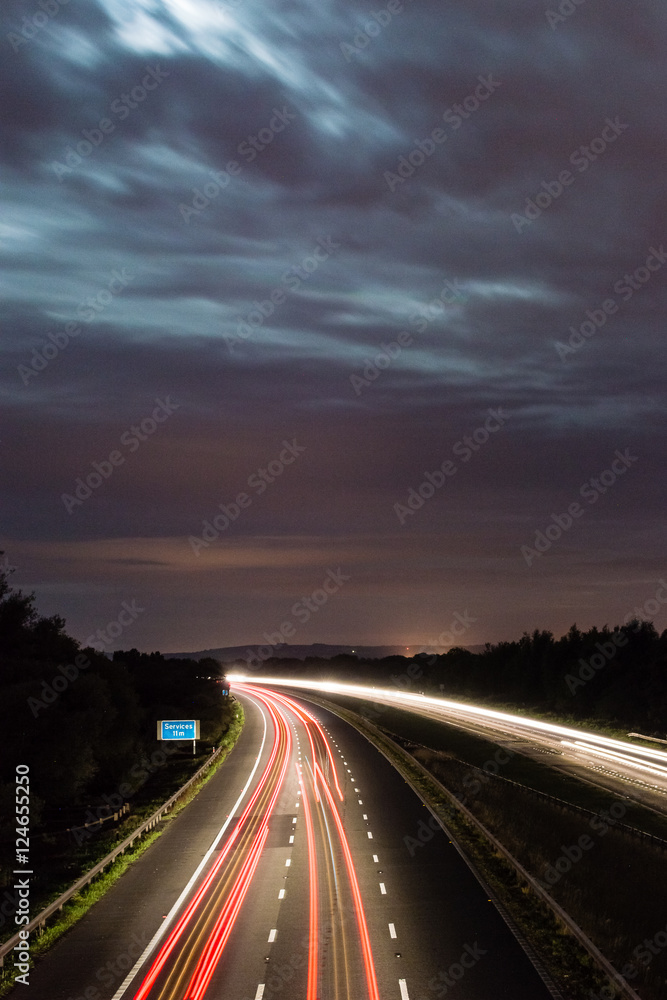 Night View on M5, transportation on motorway in England, light motion blur