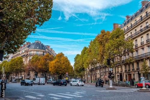 Streets of Paris, France. Blue sky, buildings and traffic. Shot in late autumn daylight.