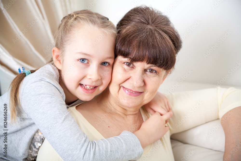 Senior lady with granddaughter happy together in domestic environment Senior lady with granddaughter happy together in domestic environment