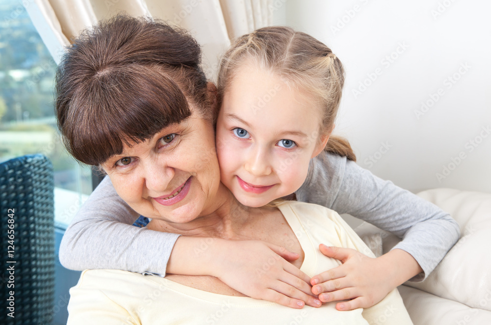 Senior lady with granddaughter happy together in domestic environment Senior lady with granddaughter happy together in domestic environment