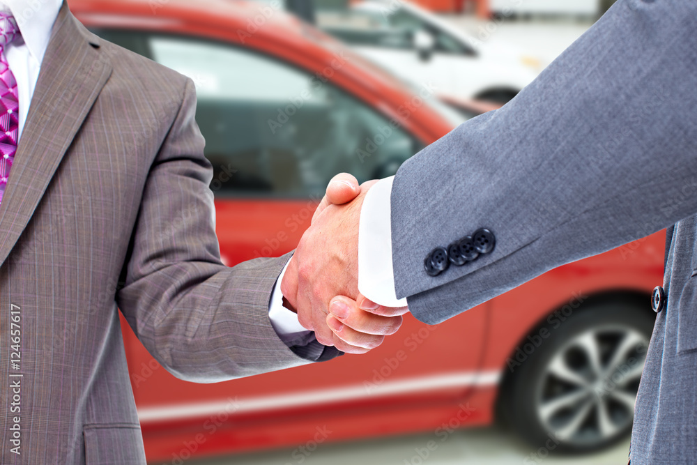 Car seller and client handshake. Car seller and client handshake.