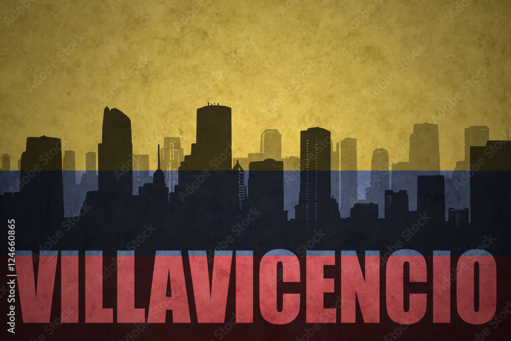 abstract silhouette of the city with text Villavicencio at the vintage colombian flag