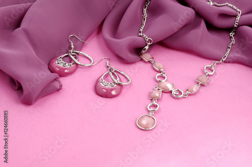 Fashion jewelry advertisement - pink bijouterie on velvet background