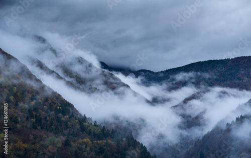 Clouds and autumnal colors in the Italian Alps