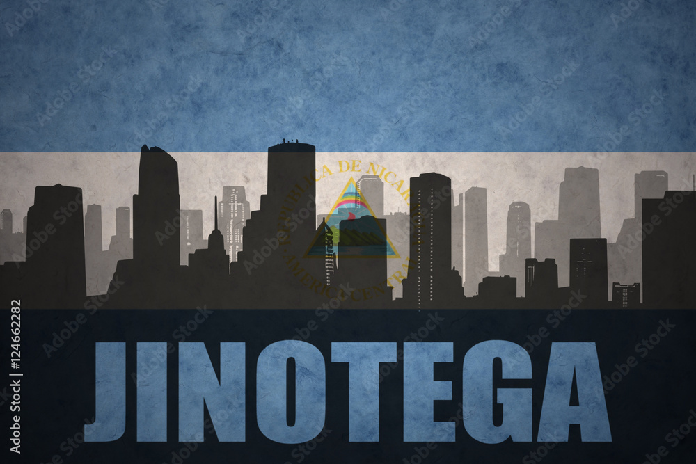 abstract silhouette of the city with text Jinotega at the vintage nicaraguan flag