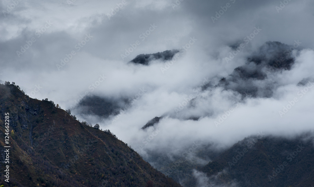 Clouds and autumnal colors in the Italian Alps Clouds and autumnal colors in the Italian Alps