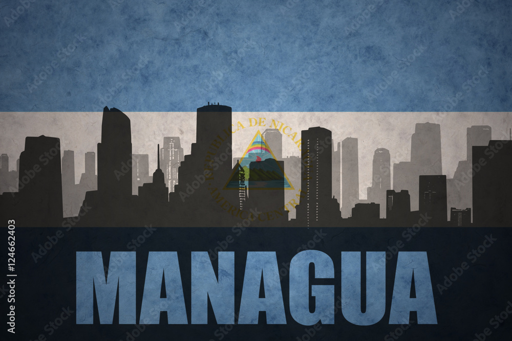 abstract silhouette of the city with text Managua at the vintage nicaraguan flag