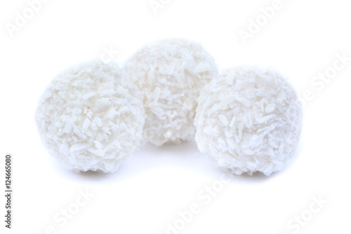 Three coconut cookies on white bacground