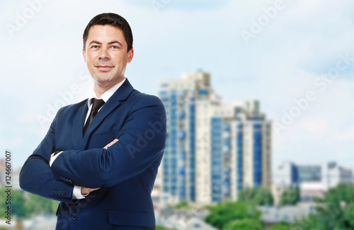 Businessman on blurred city...