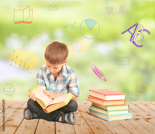 Cute little boy with book s...
