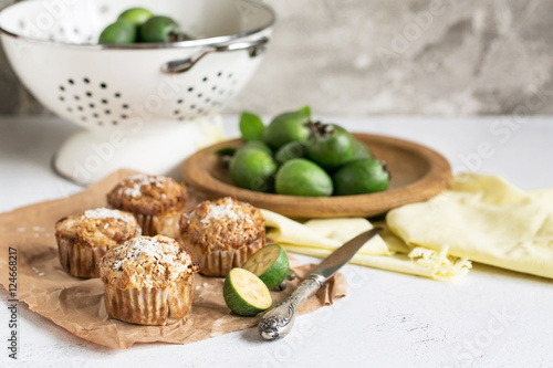 Feijoa muffins topped with shredded coconut in light composition